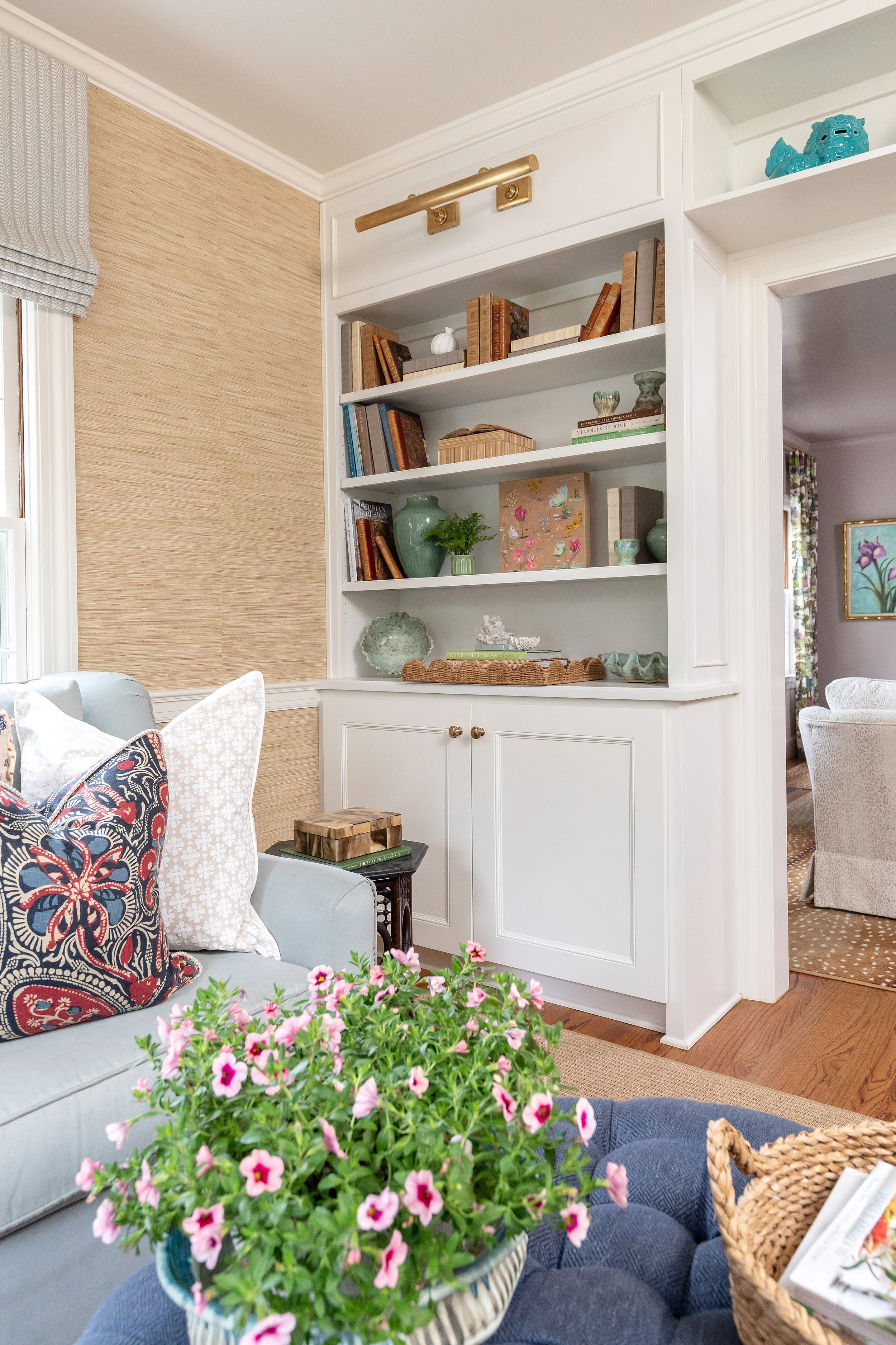 Living room with built in shelving styled by interior designer in NC