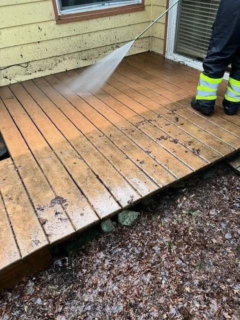 A composite deck being Pressure Washed