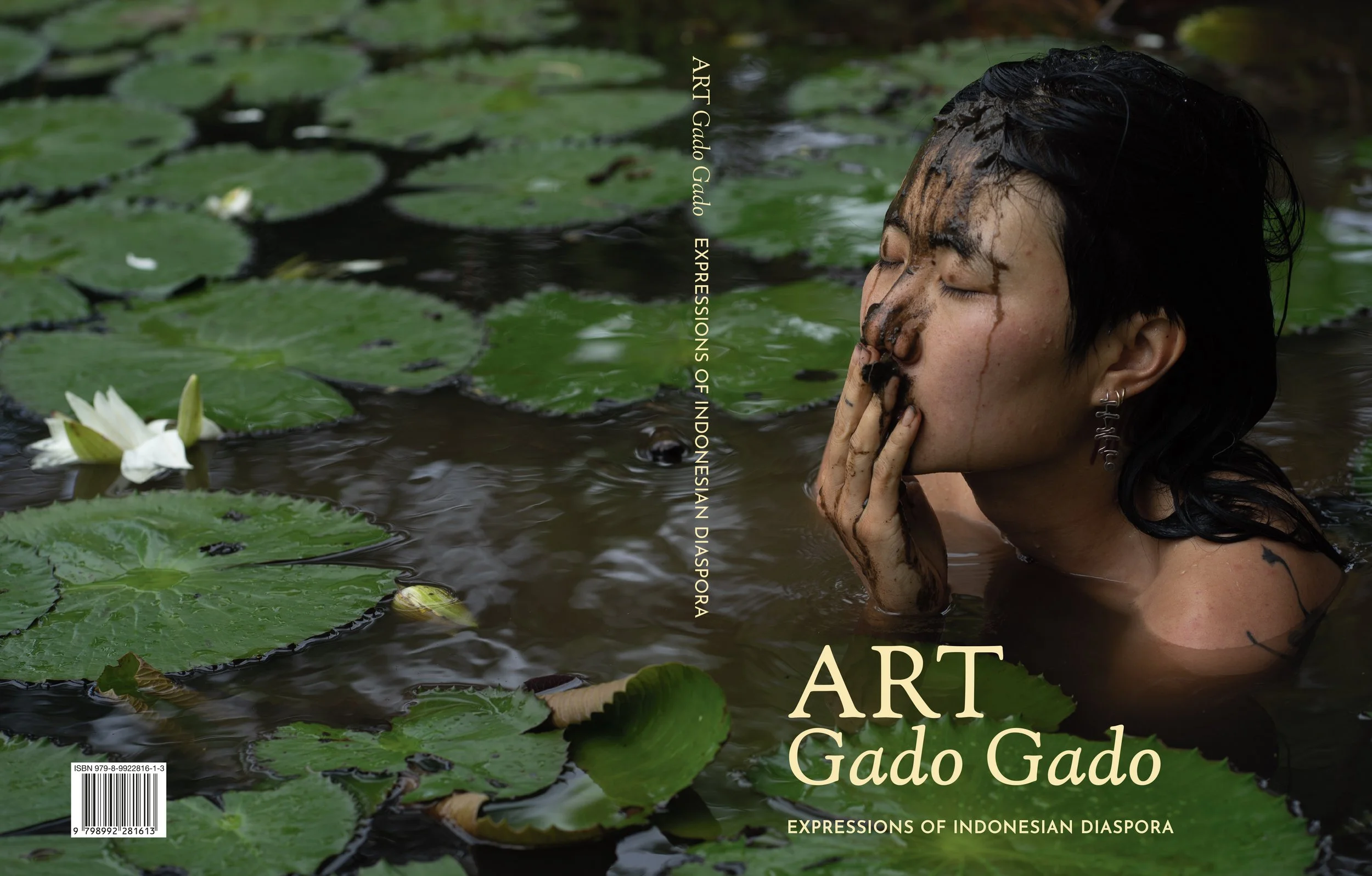 Catalog front and back. ART Gado Gado: Expressions of Indonesian Diaspora in yellow text on spine and front over image of woman mostly submerged in a lotus pond