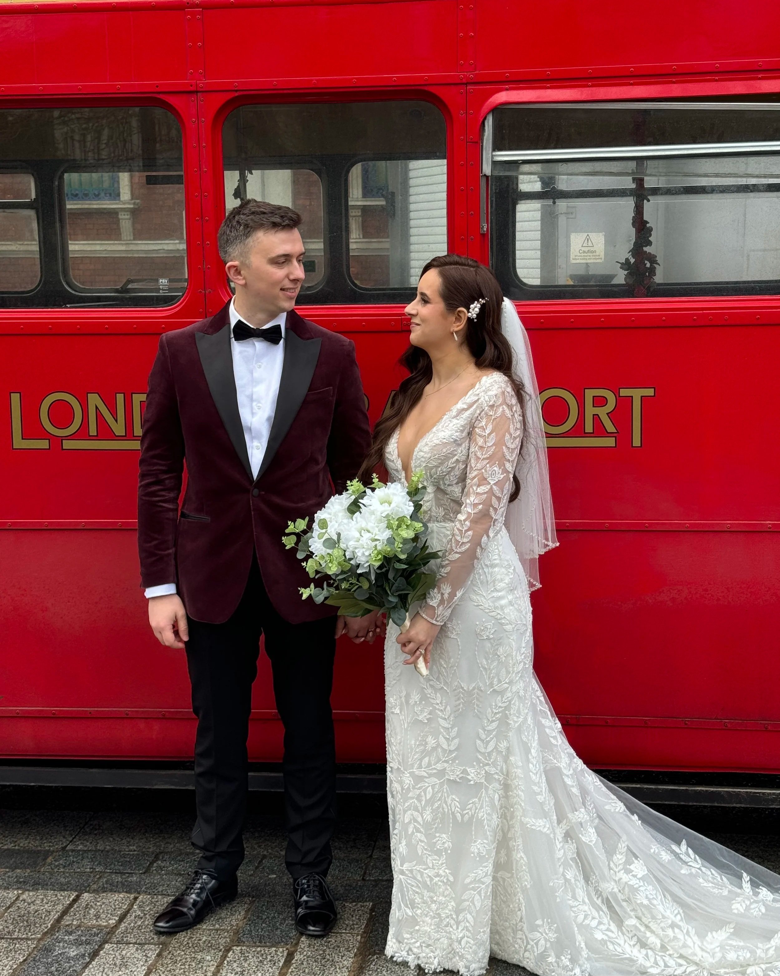 London wedding couple just married in front of London Red Bus