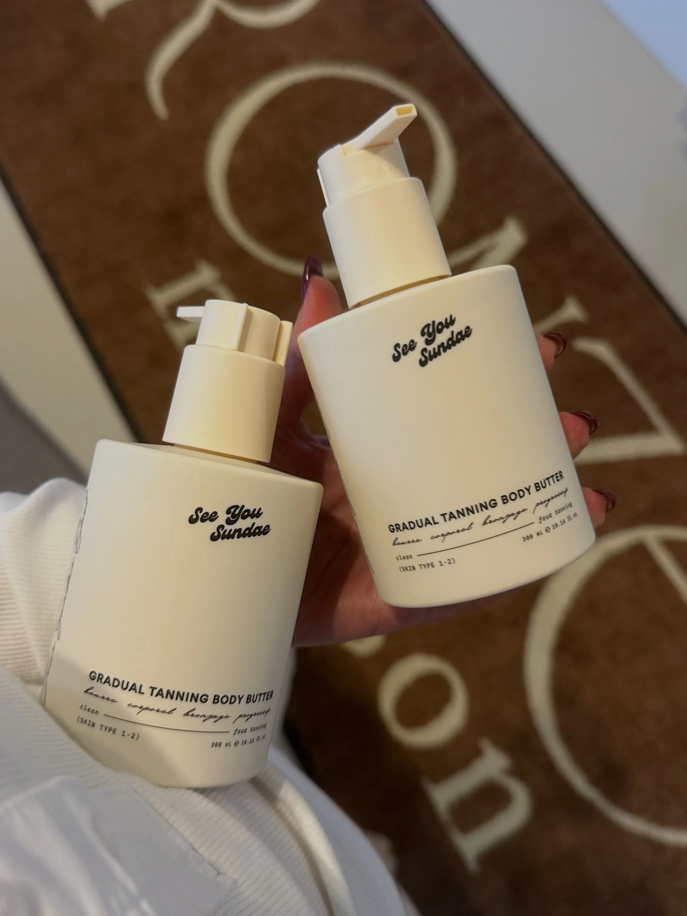 Current Obsession: See You Sundae {In-Studio}

[The Gradual Tanning Body Butter] is the one we cannot stop talking about. It builds color slowly with shea butter and apricot oil and the scent is clove and vanilla. Warm and a little spiced, more like 