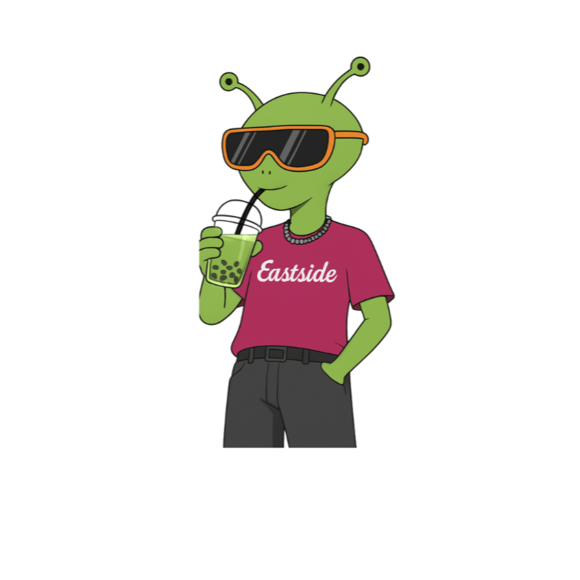 Cartoon alien with green skin, antennae, and sunglasses drinking bubble tea, wearing a pink T-shirt with 'Eastside' printed on it, and black pants.