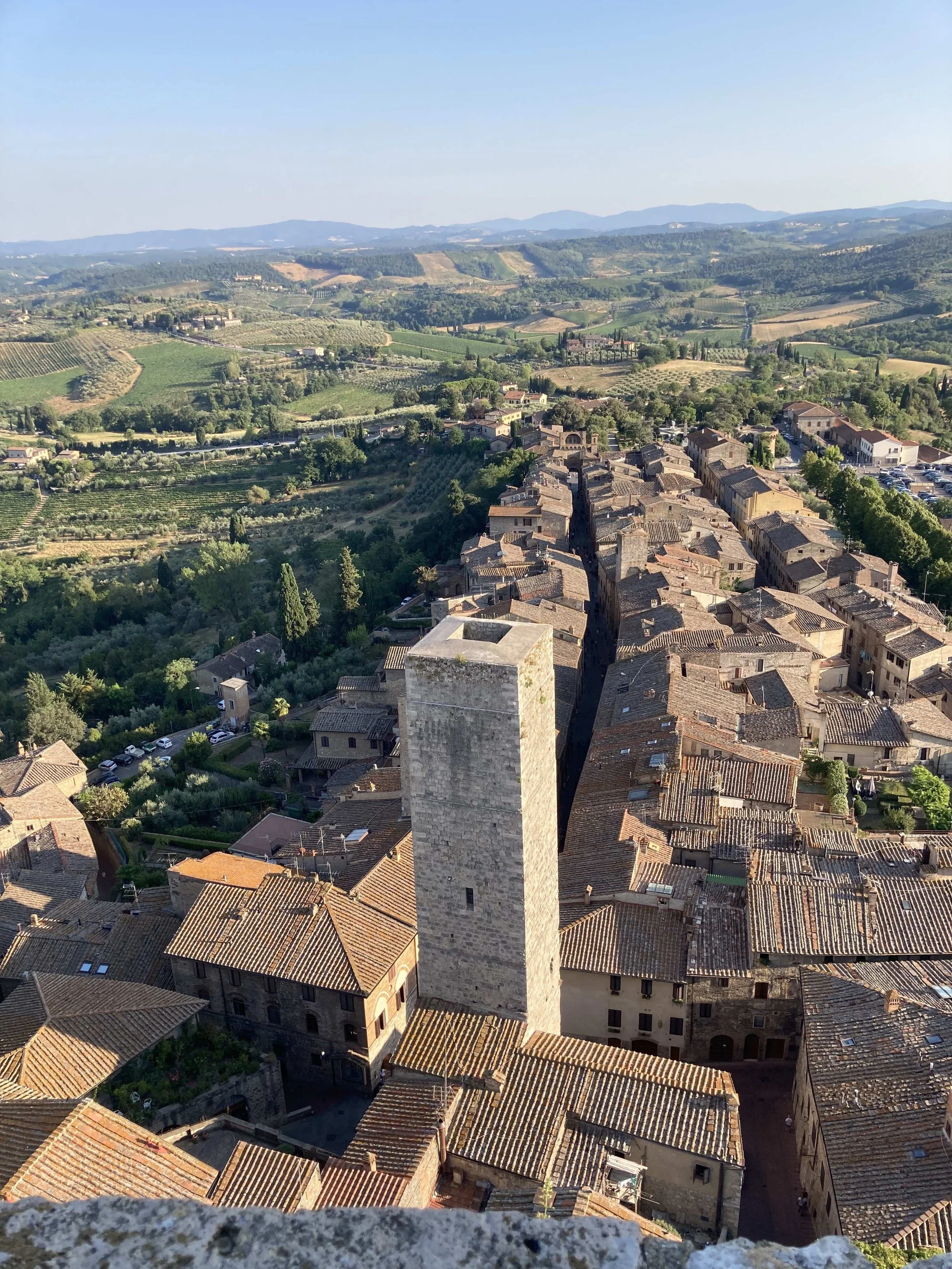7-day Tuscany yoga retreat: daily yoga, workshops, market visit, cooking class, Florence food tour, San Gimignano trip, spa day. Italy, June 2025.