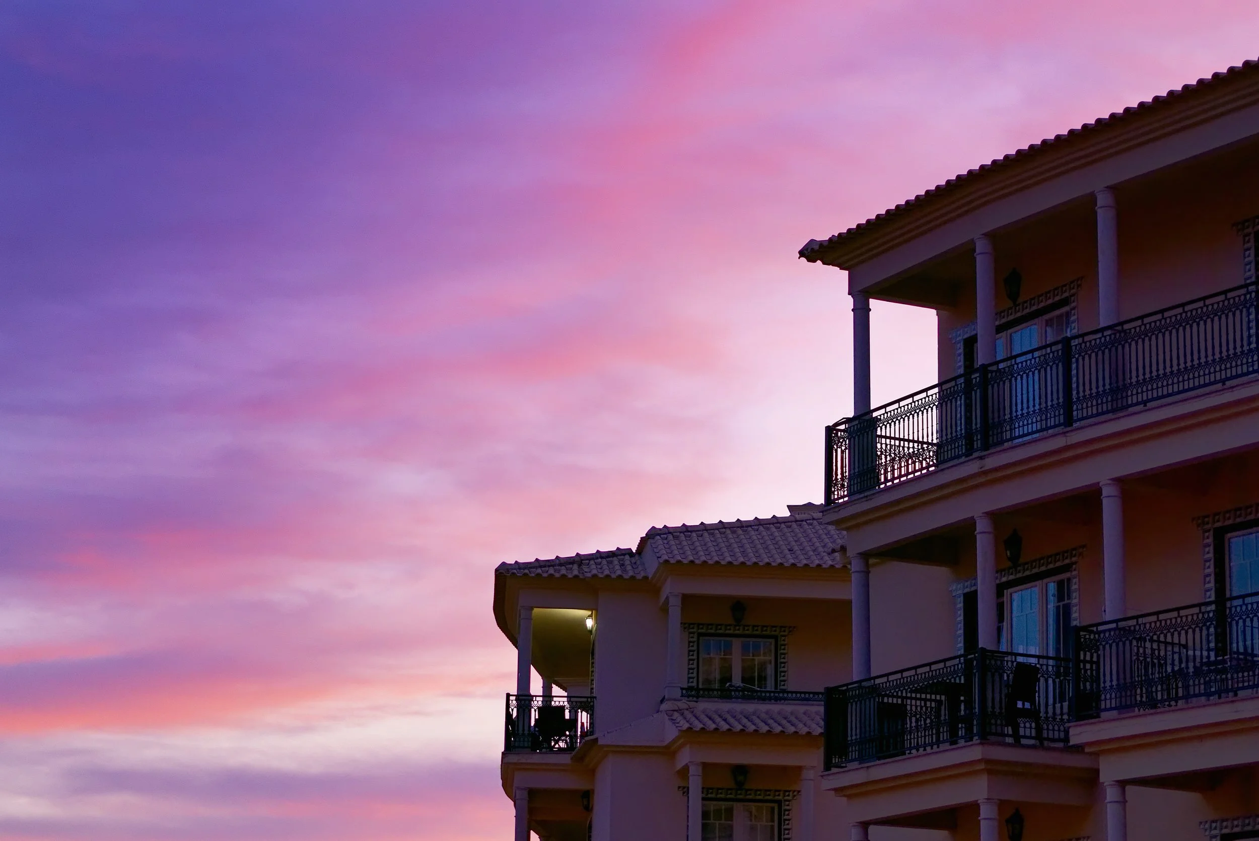 building-with-balconies-beautiful-pink-sunset-sk.jpg