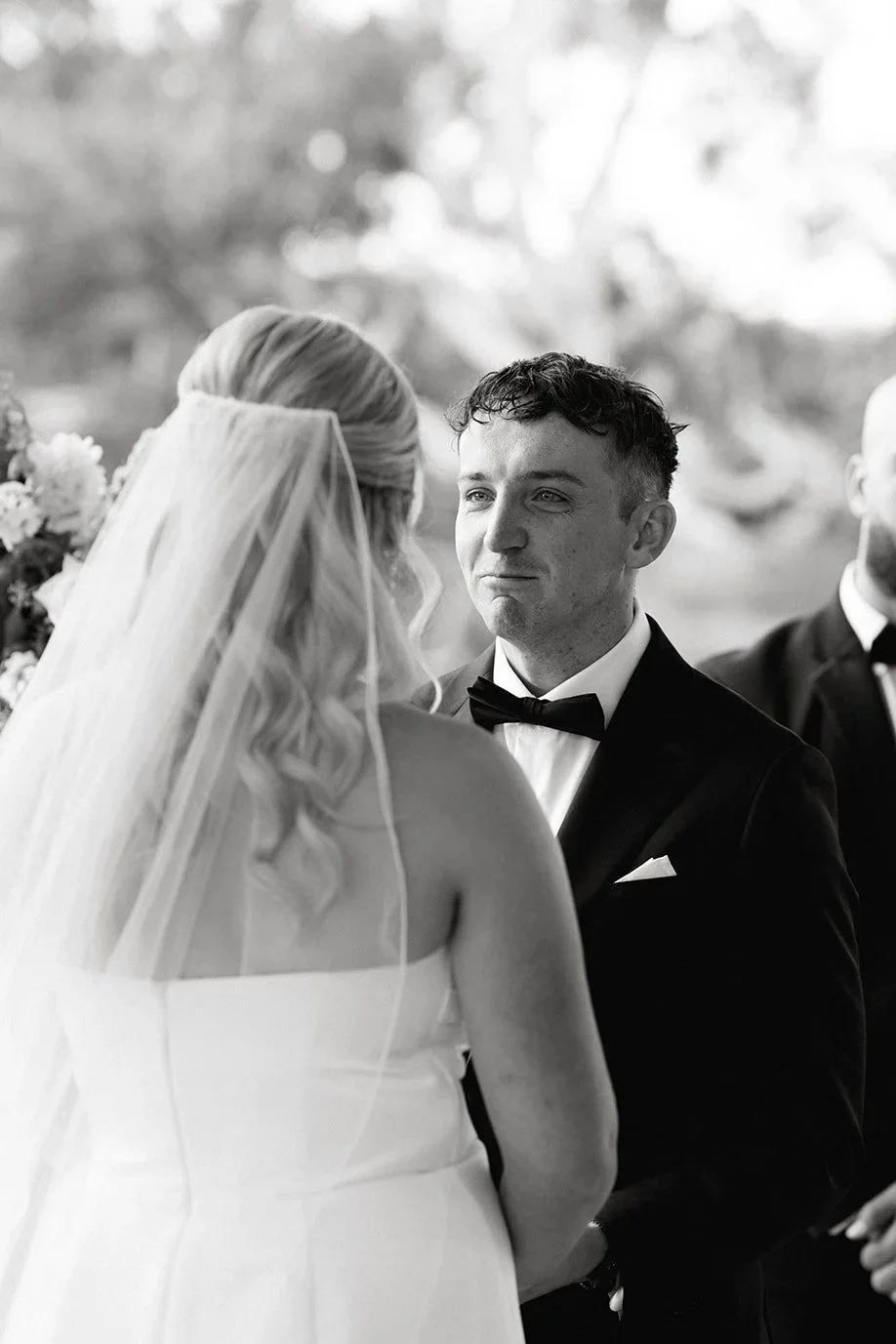 Melbourne wedding ceremony with groom emotional during vows as bride stands opposite