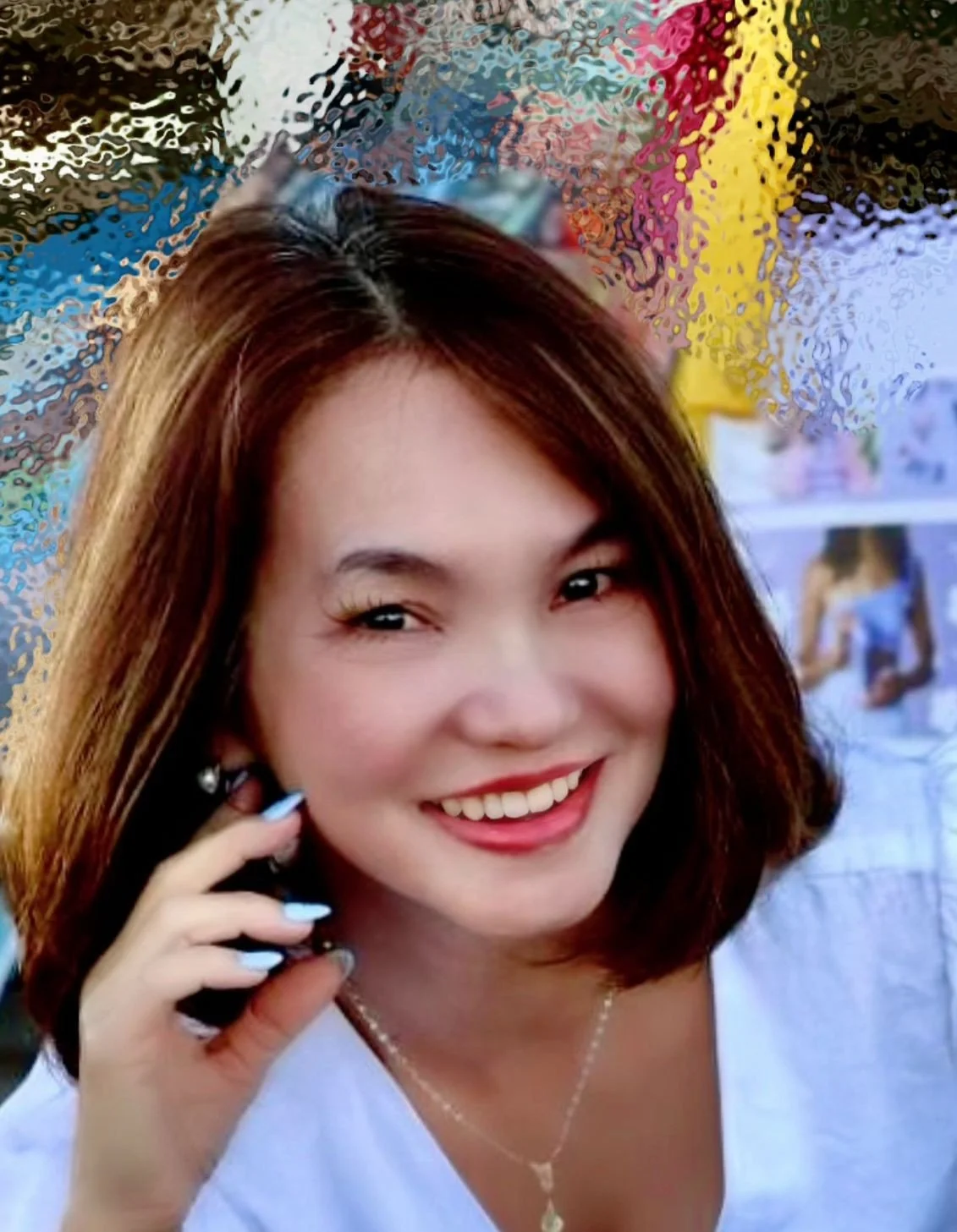 Young woman with sunglasses sitting in a yellow flower field on a cloudy day.