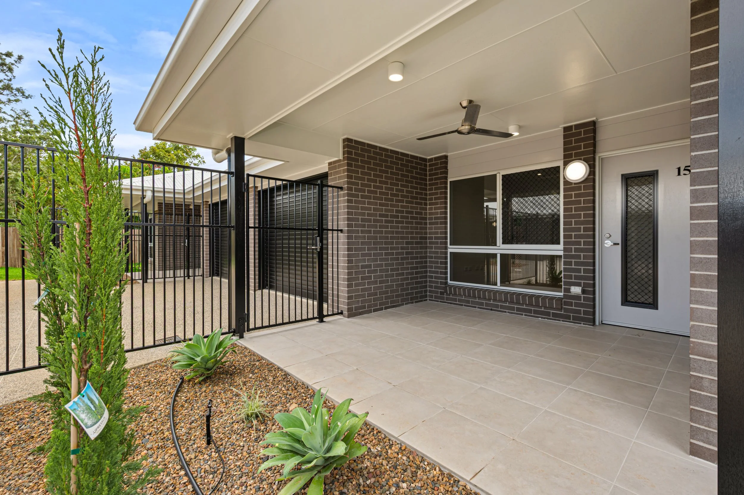 Exterior property photography of a Bundaberg home featuring neat landscaping, street appeal and attractive front facade presentation.