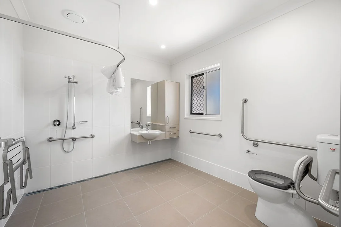 High-quality property image of a Bundaberg house featuring modern kitchen finishes, open-plan design and natural light throughout