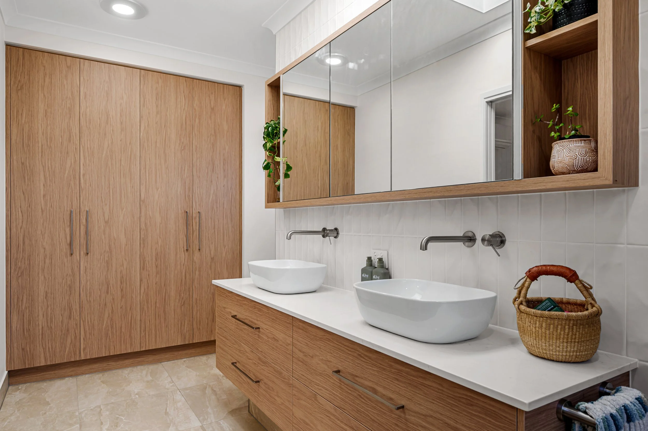 Completed renovation image of a Bundaberg home showcasing elegant open-plan living spaces, polished interiors and premium styling details.