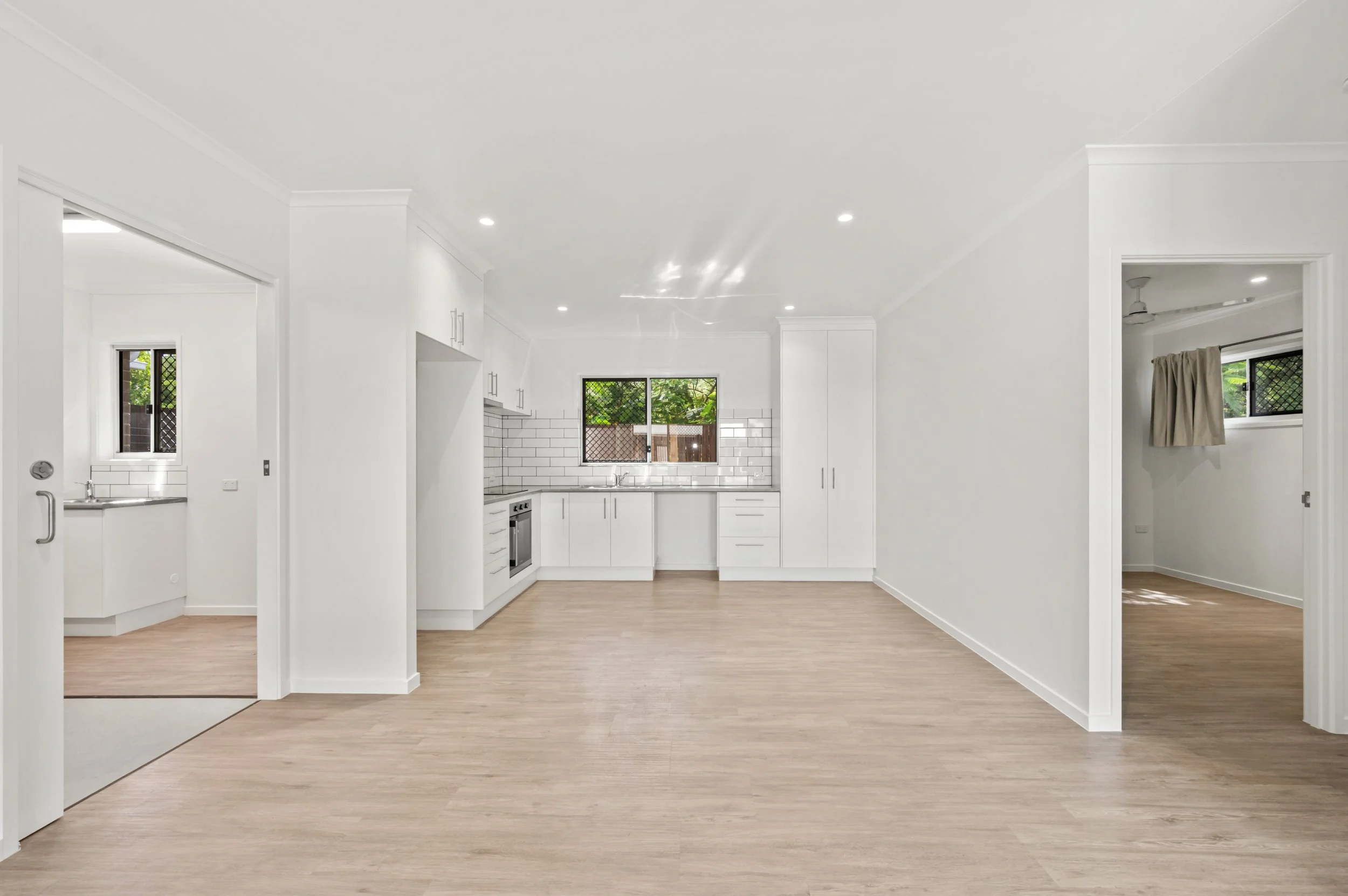 Interior photography of a newly built unit in Bundaberg featuring modern kitchen finishes, open-plan living spaces and quality property presentation.