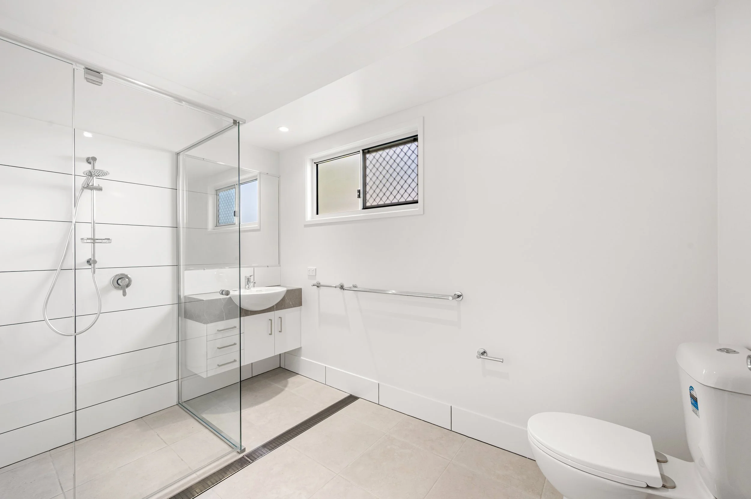 Bright interior photo of a new residential unit in Bundaberg highlighting spacious bedrooms, natural light and contemporary design features.