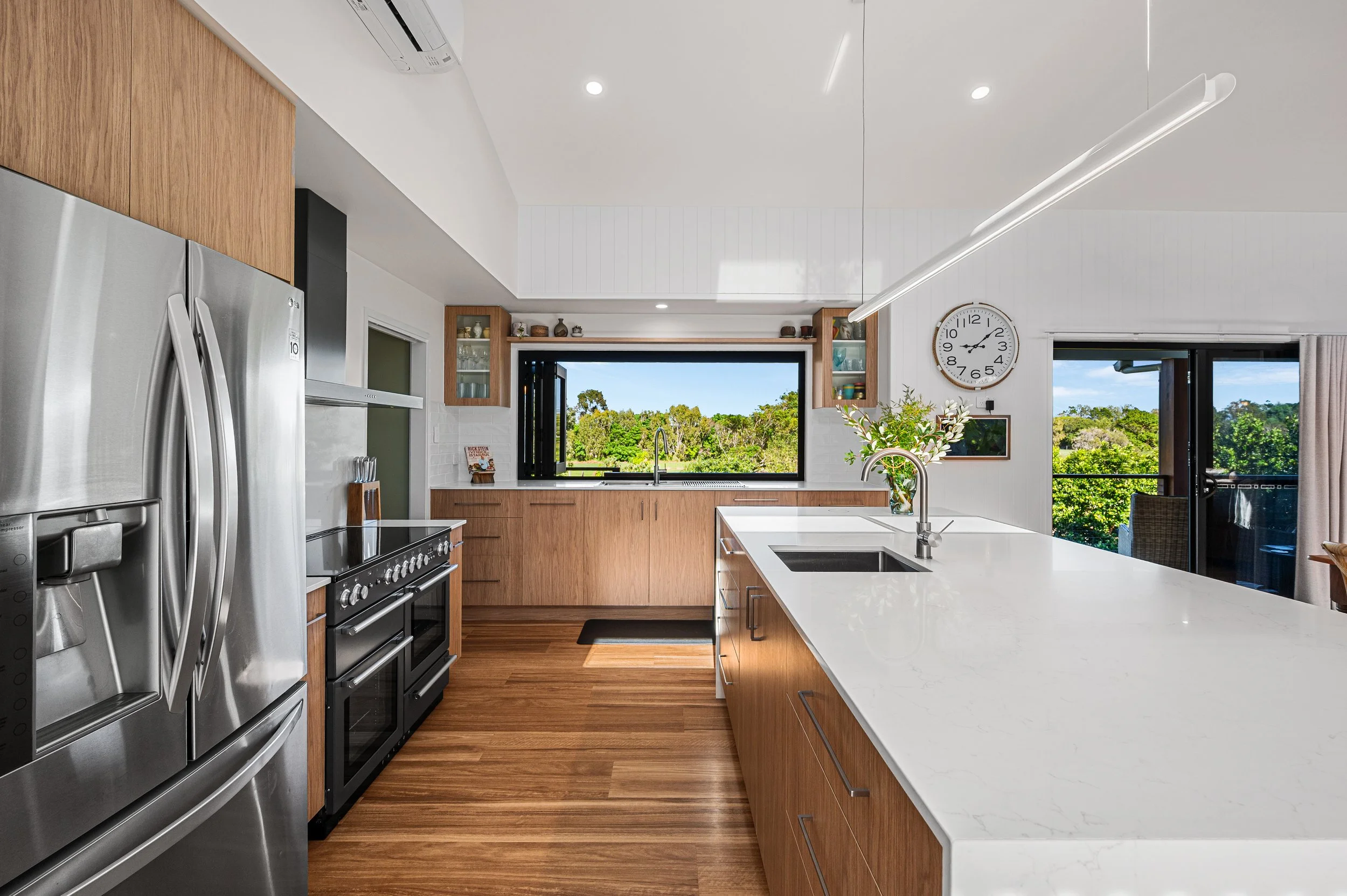 Luxury residential renovation photography in Bundaberg showcasing transformed exterior spaces, landscaped surrounds and impressive street appeal.