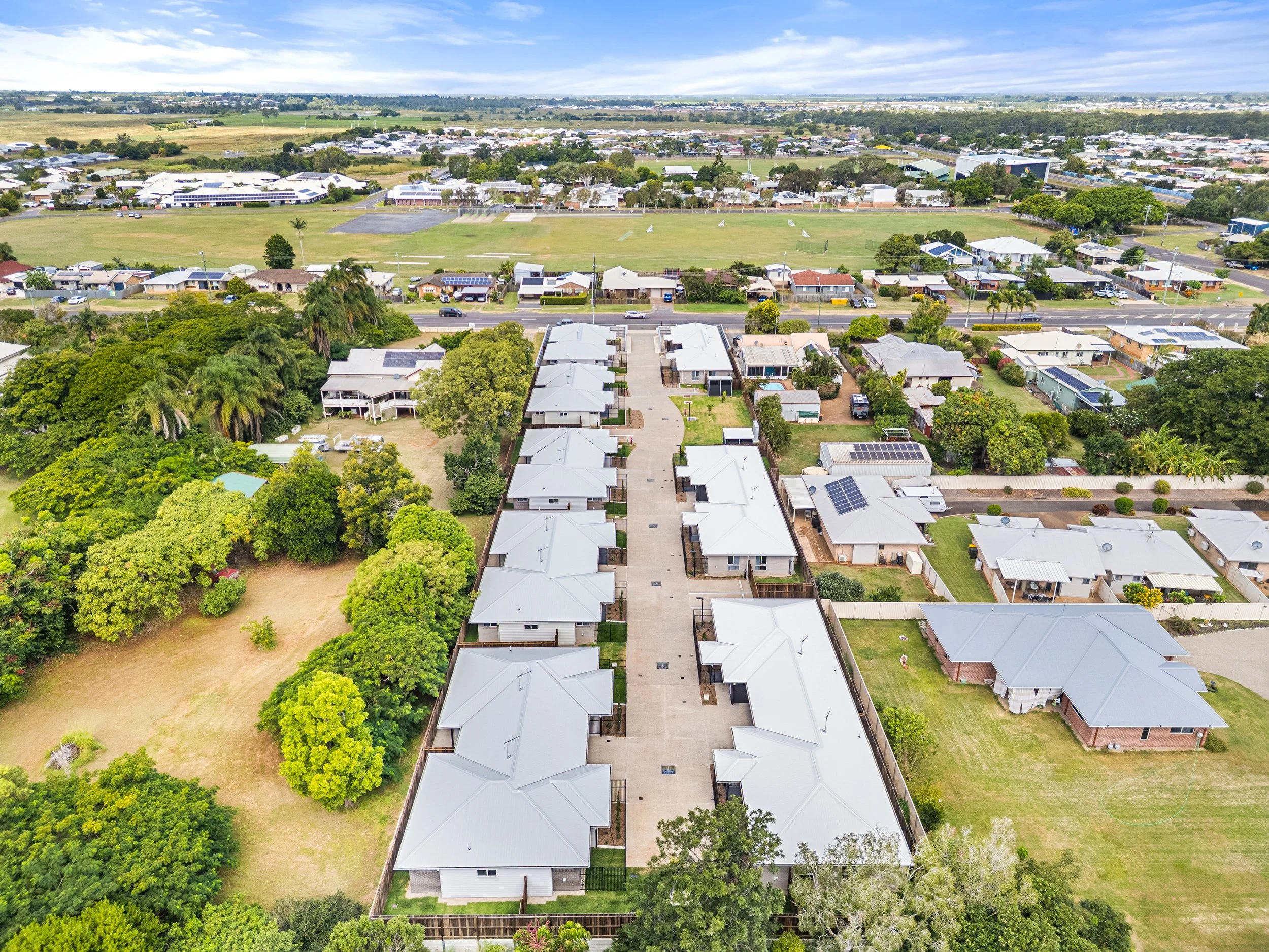 Aerial drone image of a commercial building project in Bundaberg showcasing construction progress, site layout and professional development photography services.