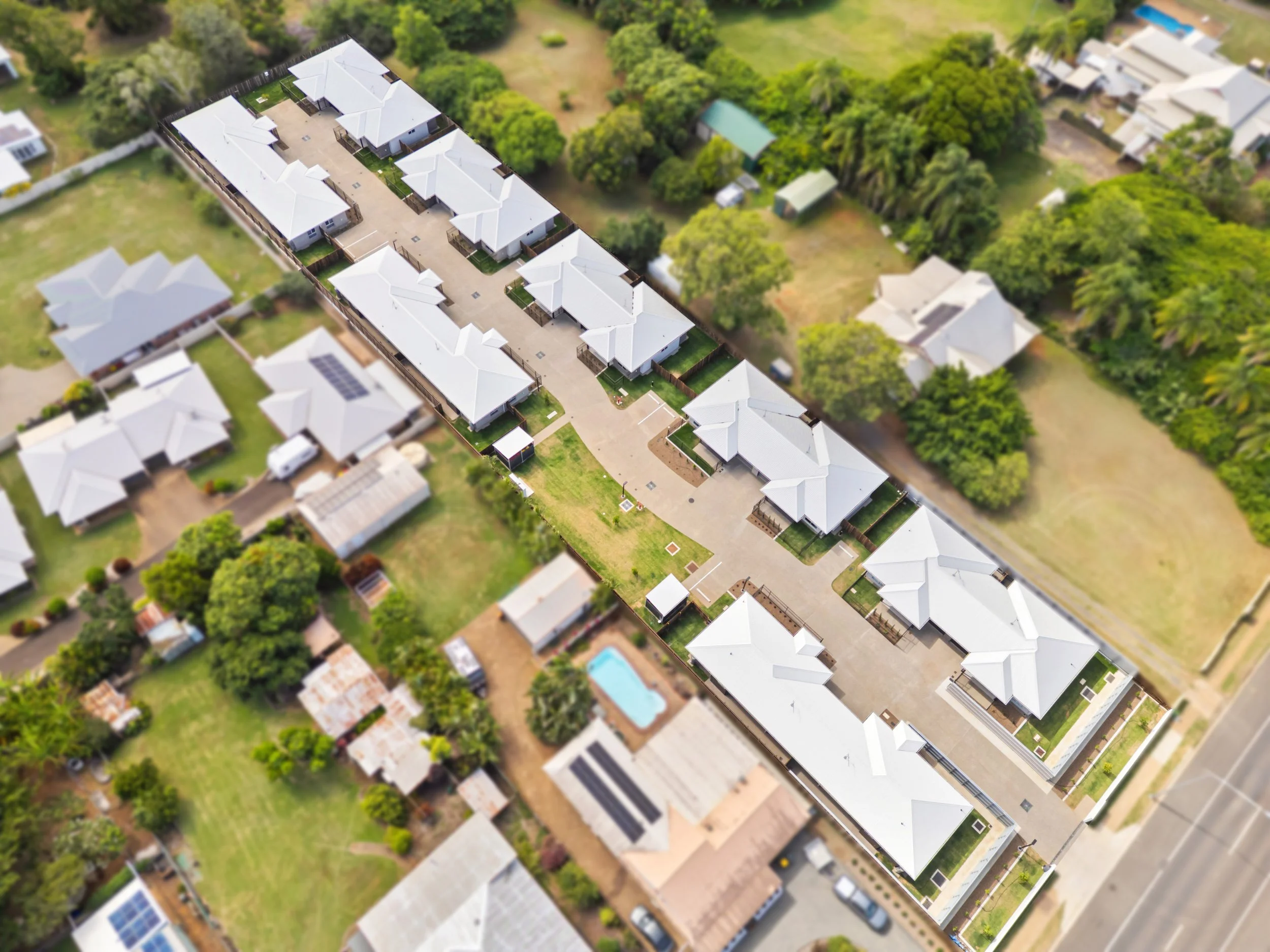 High-resolution drone photography of a Bundaberg commercial construction site capturing scale, access points and completed exterior works for marketing