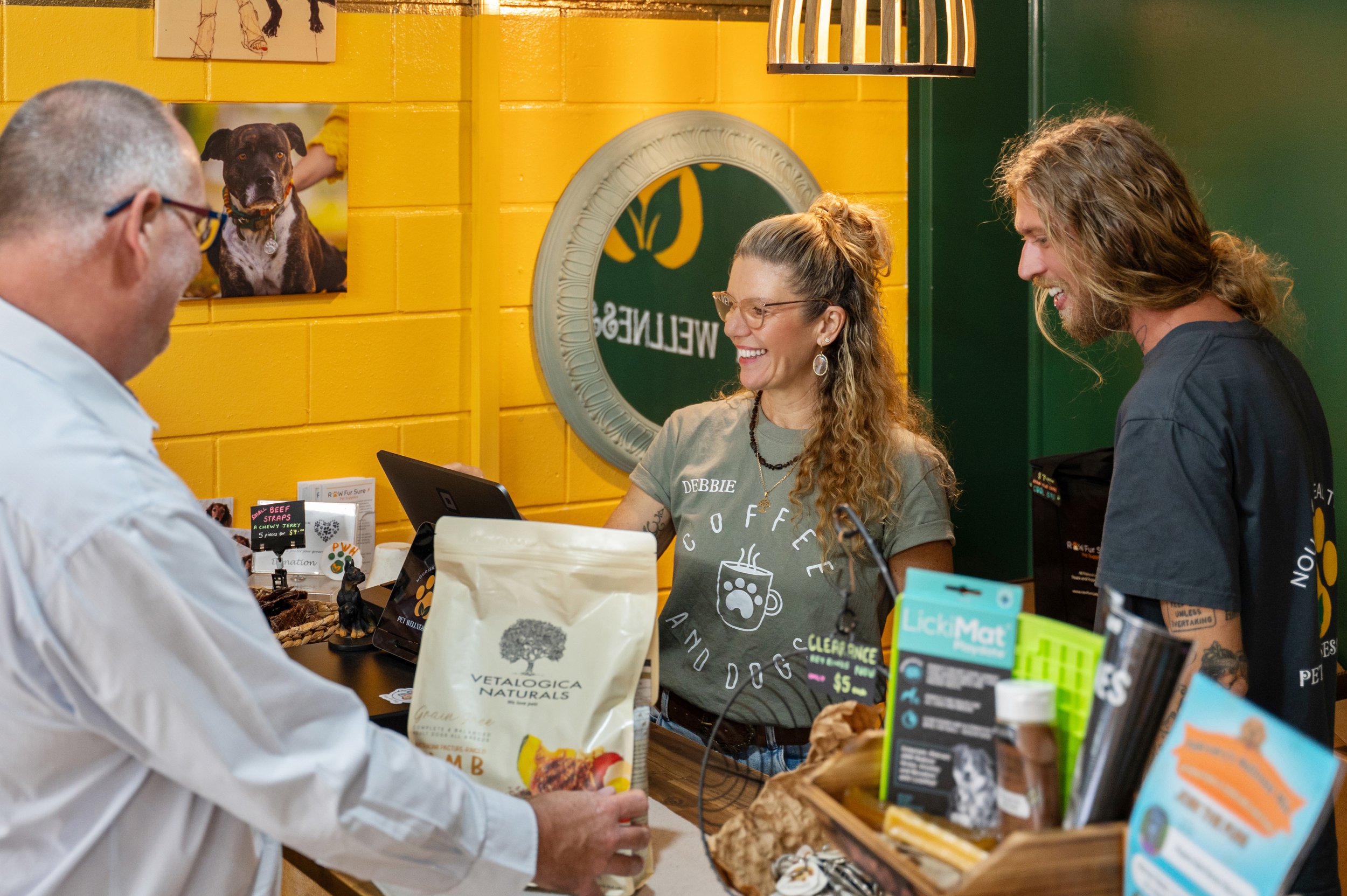 Professional branding photo of a Bundaberg business owner standing inside their local storefront, showcasing personality, professionalism and community connection