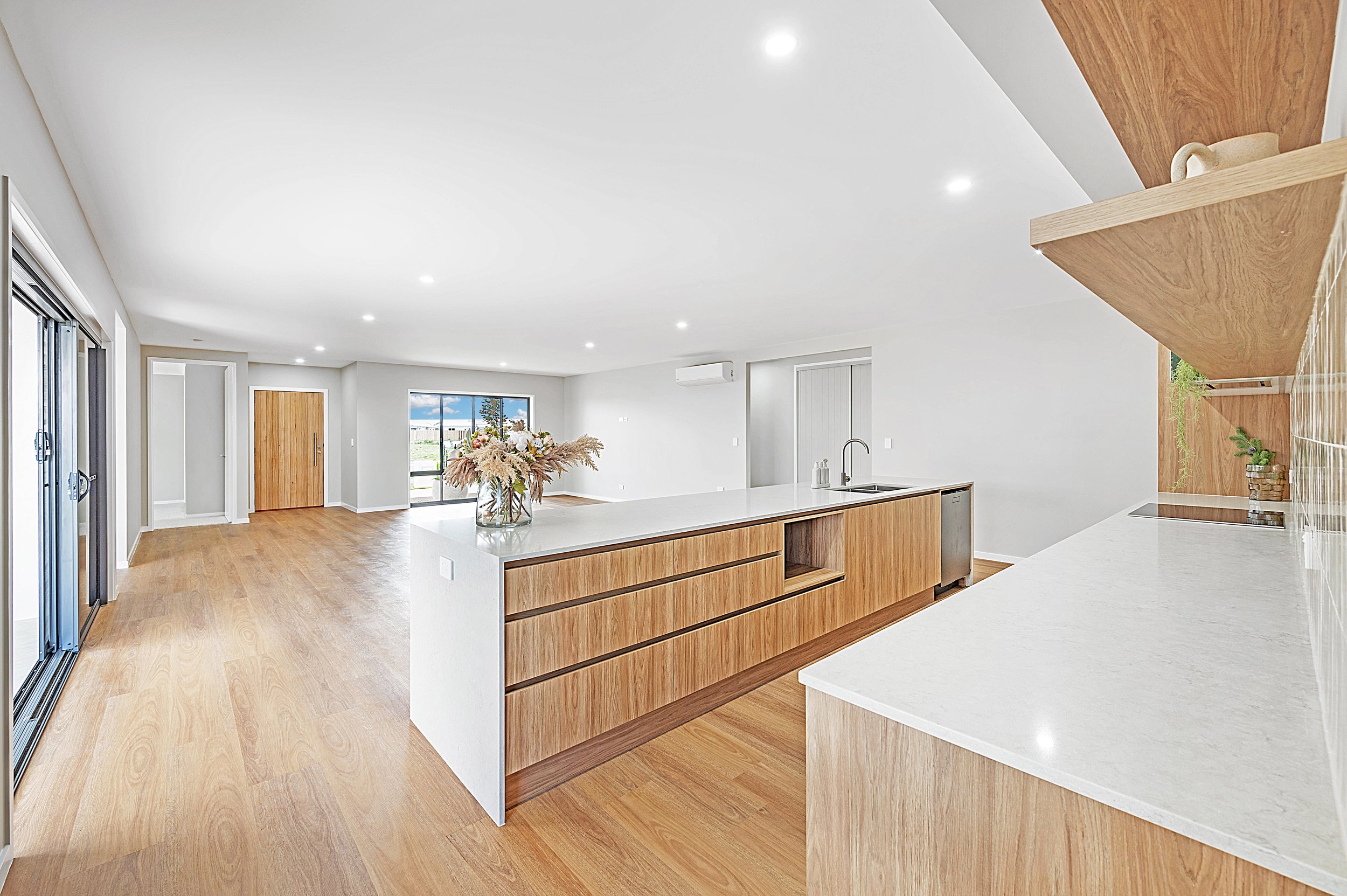 finished photo of kitchen and living area in luxury new build of bargara headlands