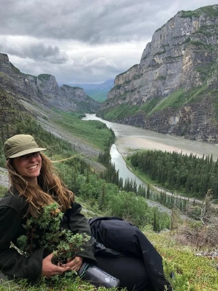 Photo of consultant on the banks of the Nahanni (Naha Dehe) during work with the Western Arctic Youth Collective that brought indigenous youth from across the NWT, Yukon and Alaska to paddle the river. Photo by: Canadian River Expeditions.