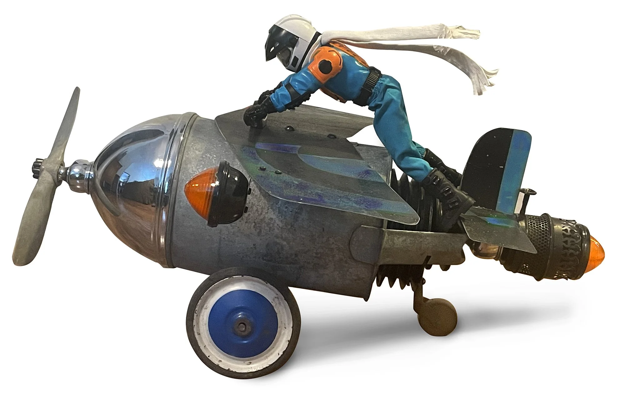Fearless Flyer 71, 2026  / watering can, lights, wheels, recycled metal sign, casters /
26 x 20 x 18 inches / 