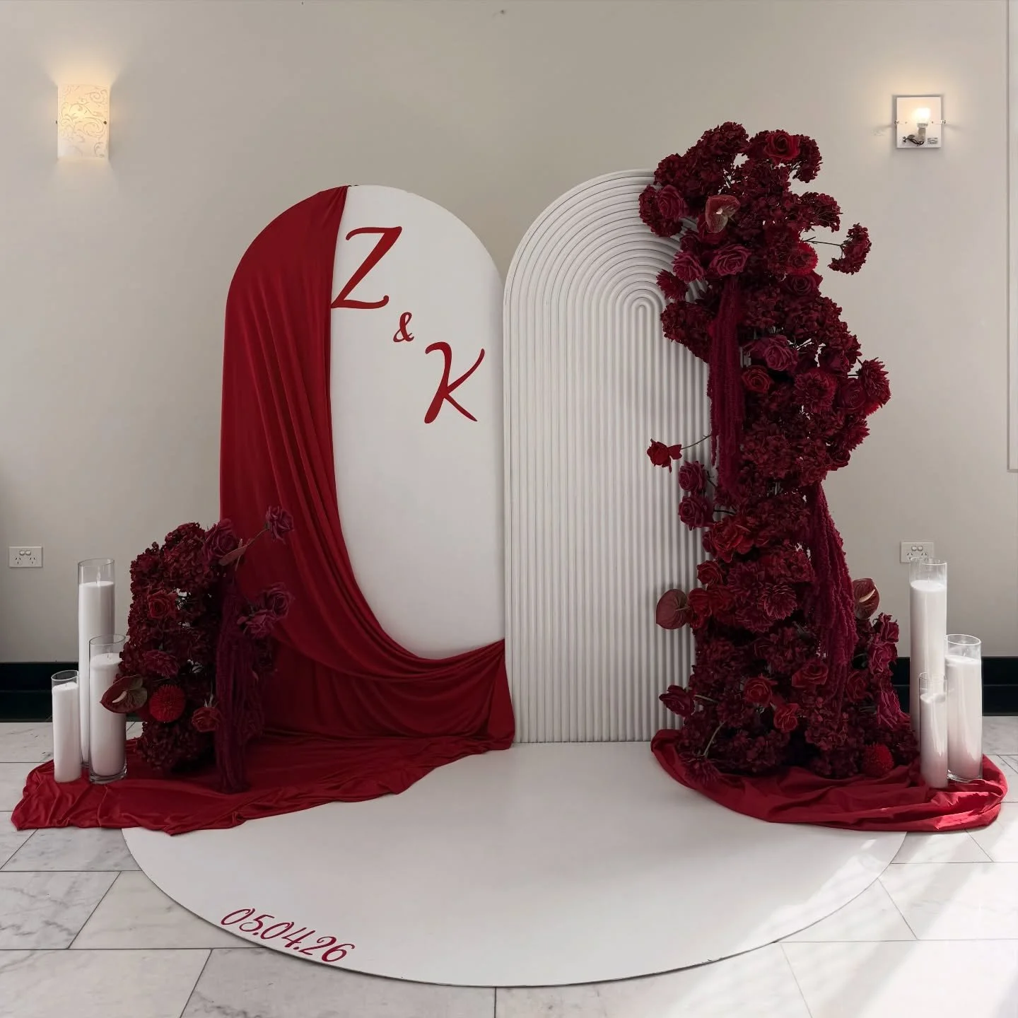 A moment for the details ❤️ 

This bold and romantic setup featured rich red florals, flowing drapery and custom initials, creating the perfect statement backdrop for a truly unforgettable celebration. 

From the luxe textures to the candles, every e