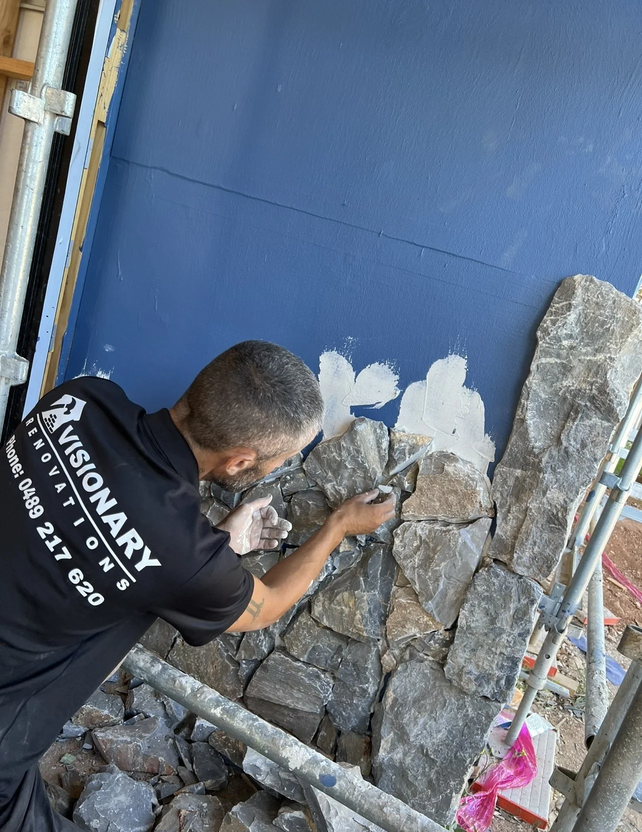 During a stonemasonery feature wall 