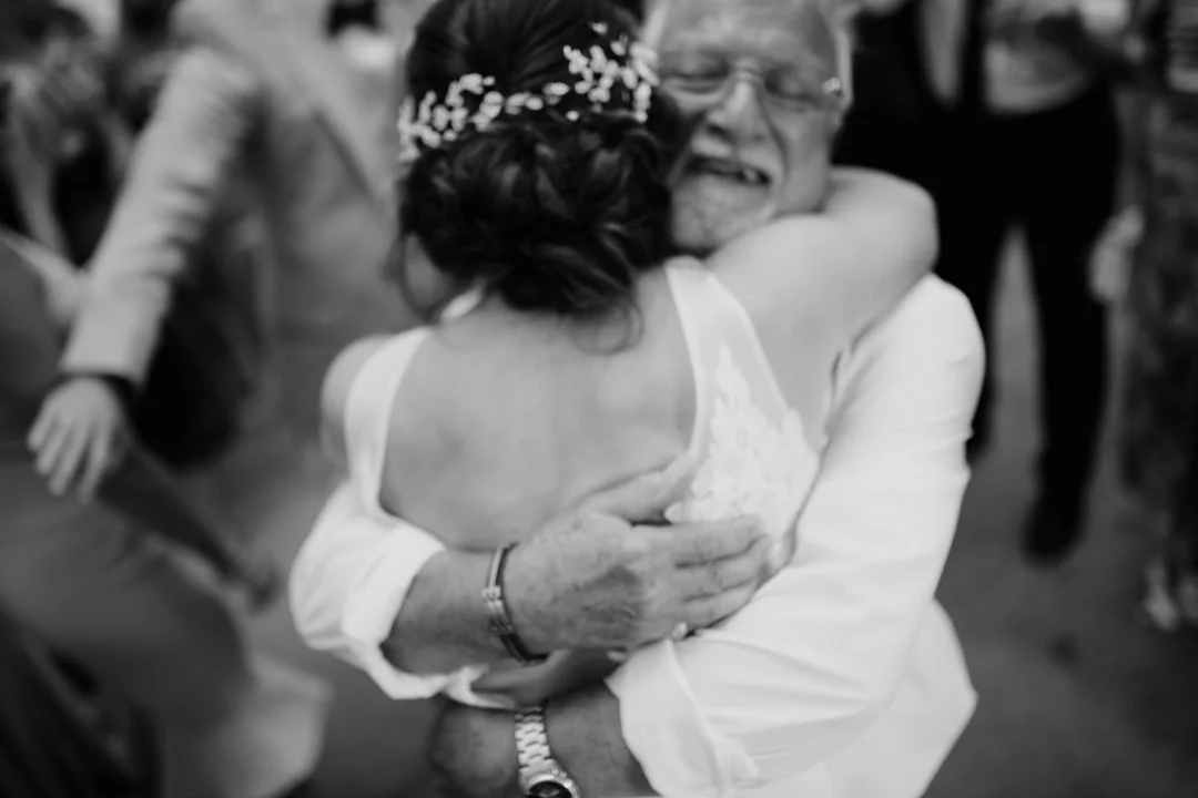 bride hugging her father on dance floor