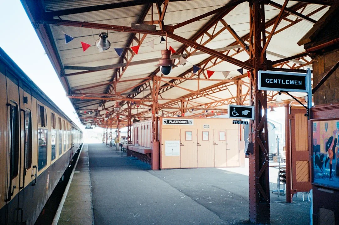 mine head railway station with red and blue bunting