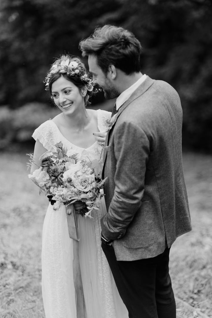 bride in white dress waring flower crown