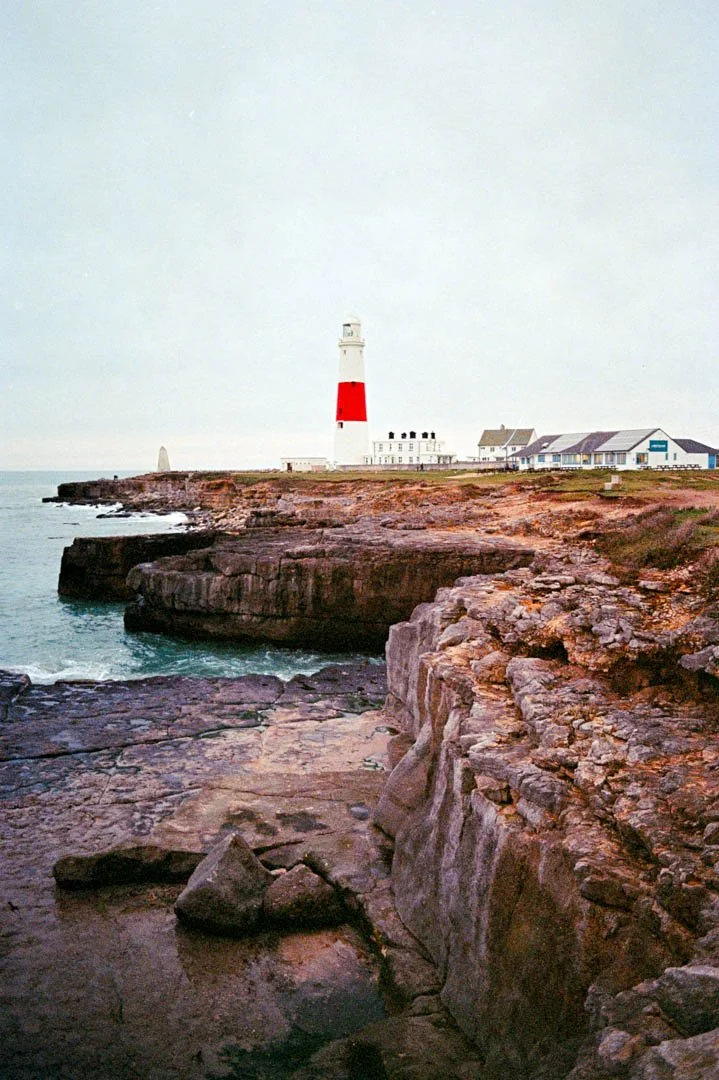 lighthouse on rock with stormy skies, Portland Bill Dorset