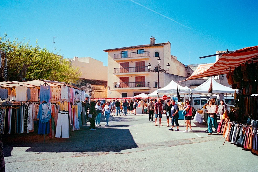 Alcudia Market with stalls selling leather bags and clothes