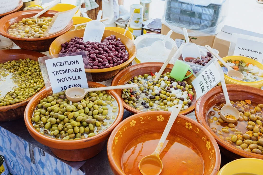 pots filled with olives on market table, Alcudia