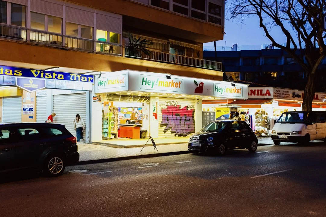 Supermarket during night time with neon lights above the door, Palma Nova