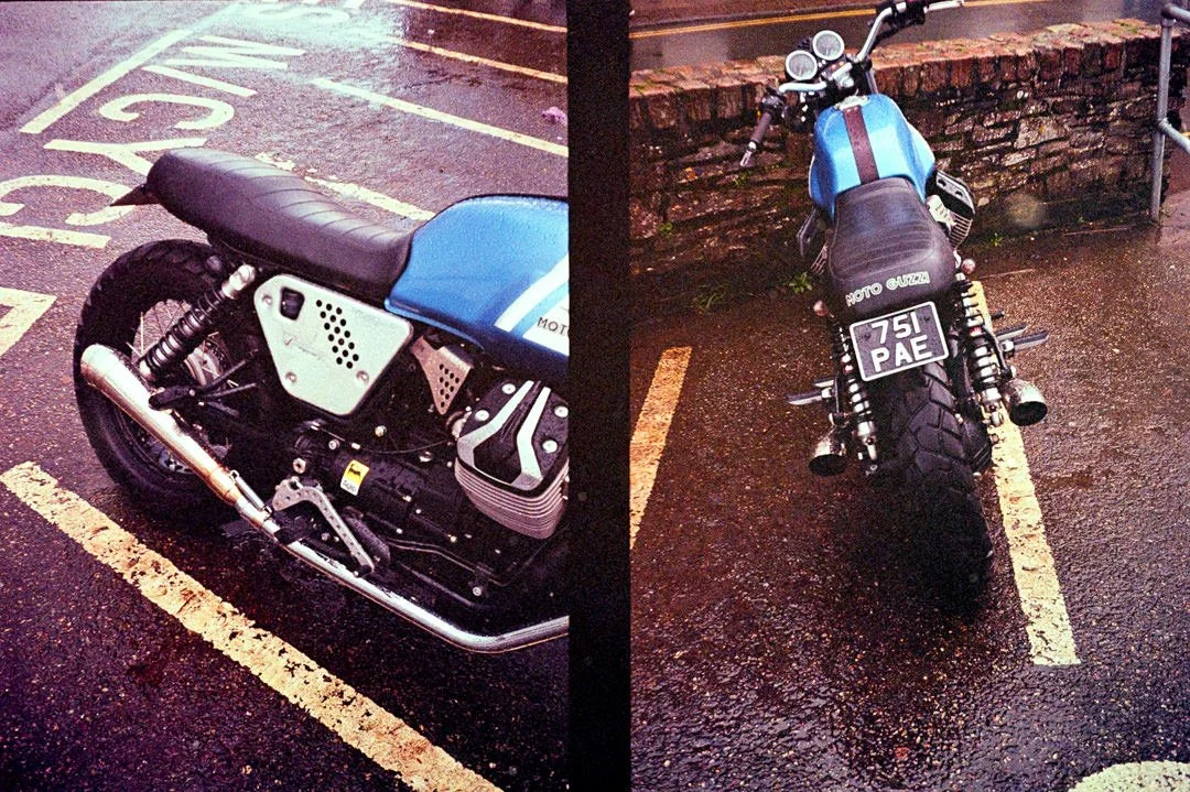 black and blue motorcycle on road next to yellow lines
