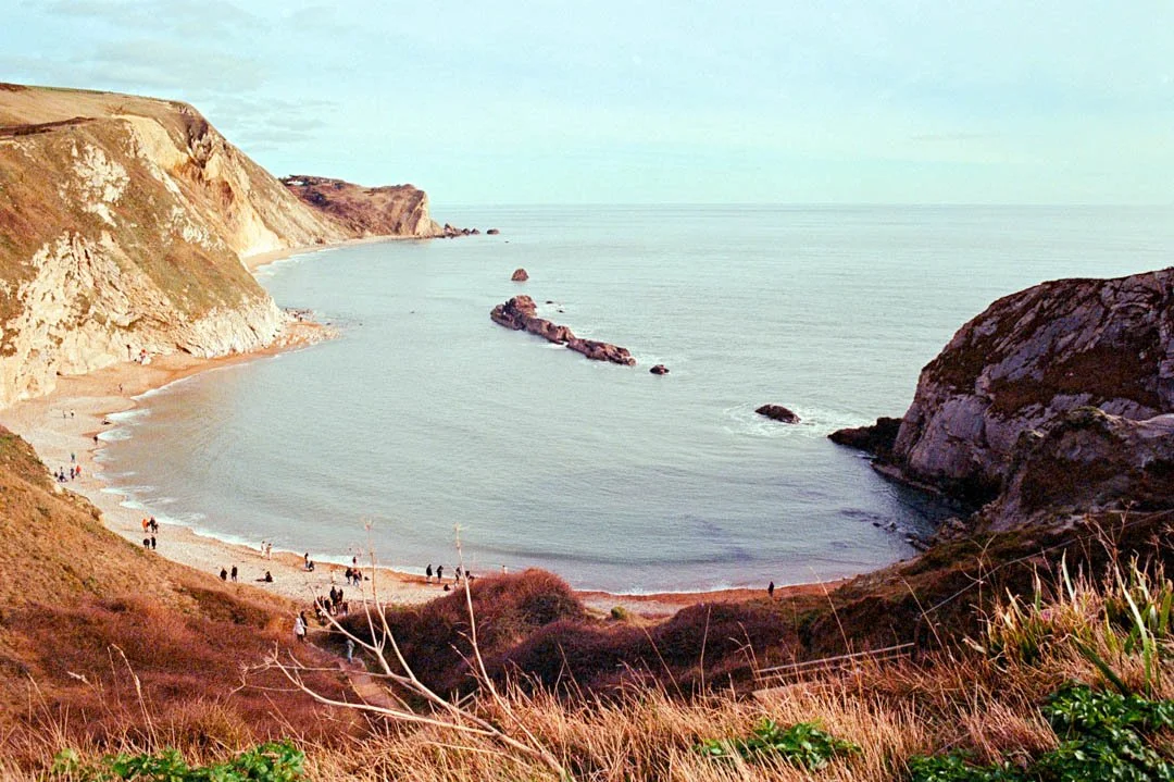 large cliffs with blue ocean water, Canon A-1