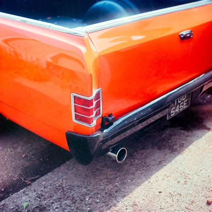 orange dodge car with chrome bumpers, Kodak ektar
