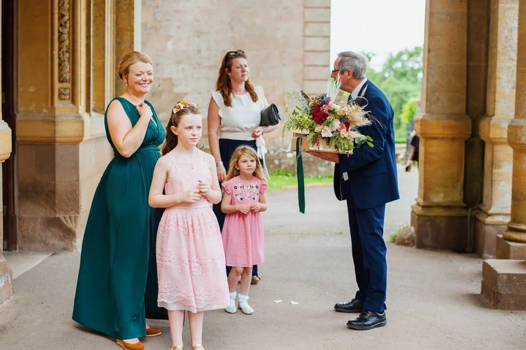 bridesmaids stood under large stone doorway, Hestercombe House taunton