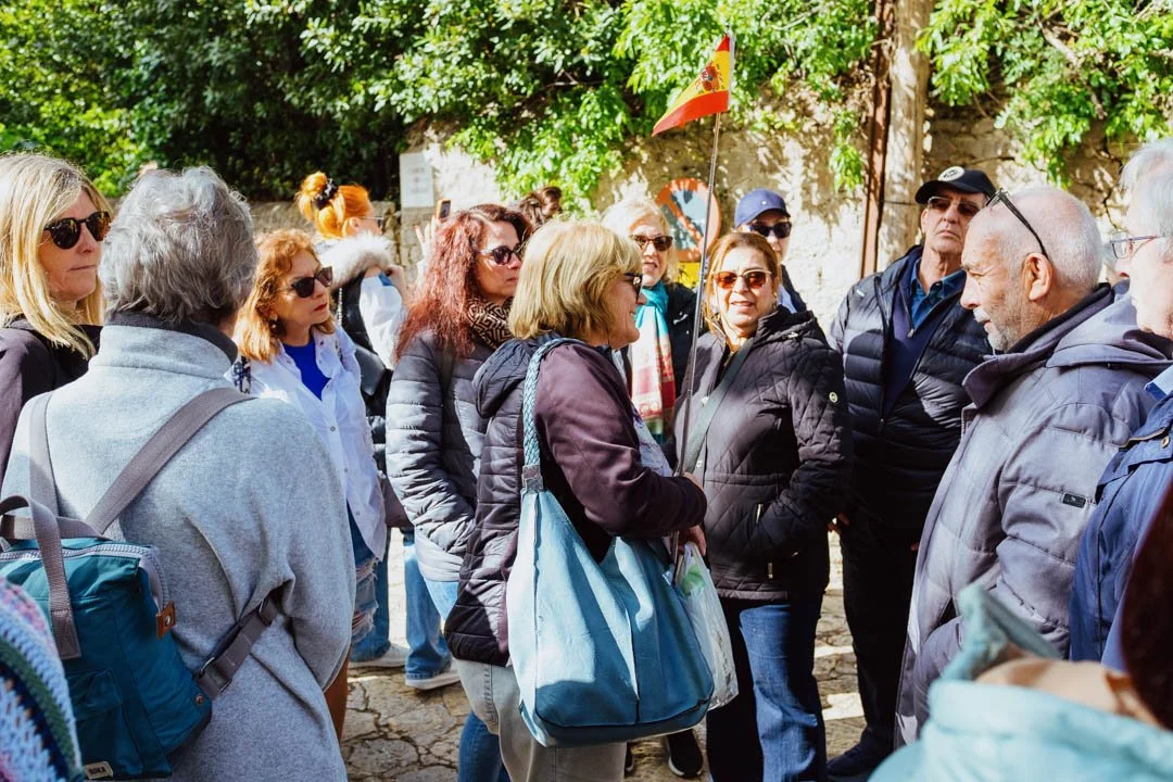 Lemon Tours Guide holding Spanish flag Valldemossa