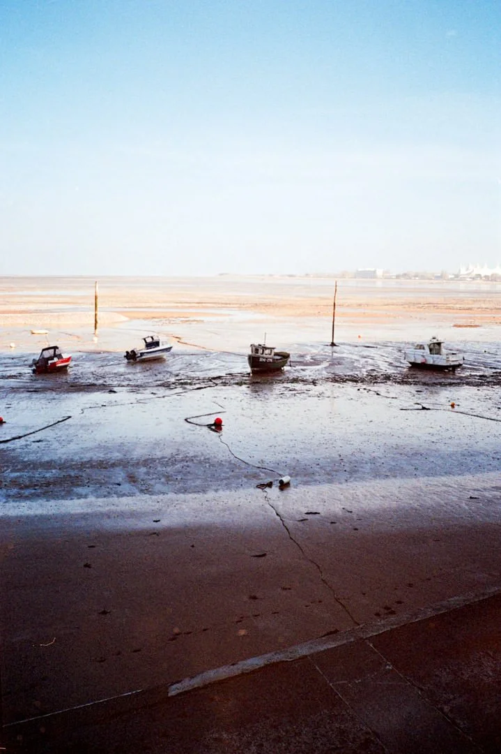 mine head harbour during sunset. the tide is out