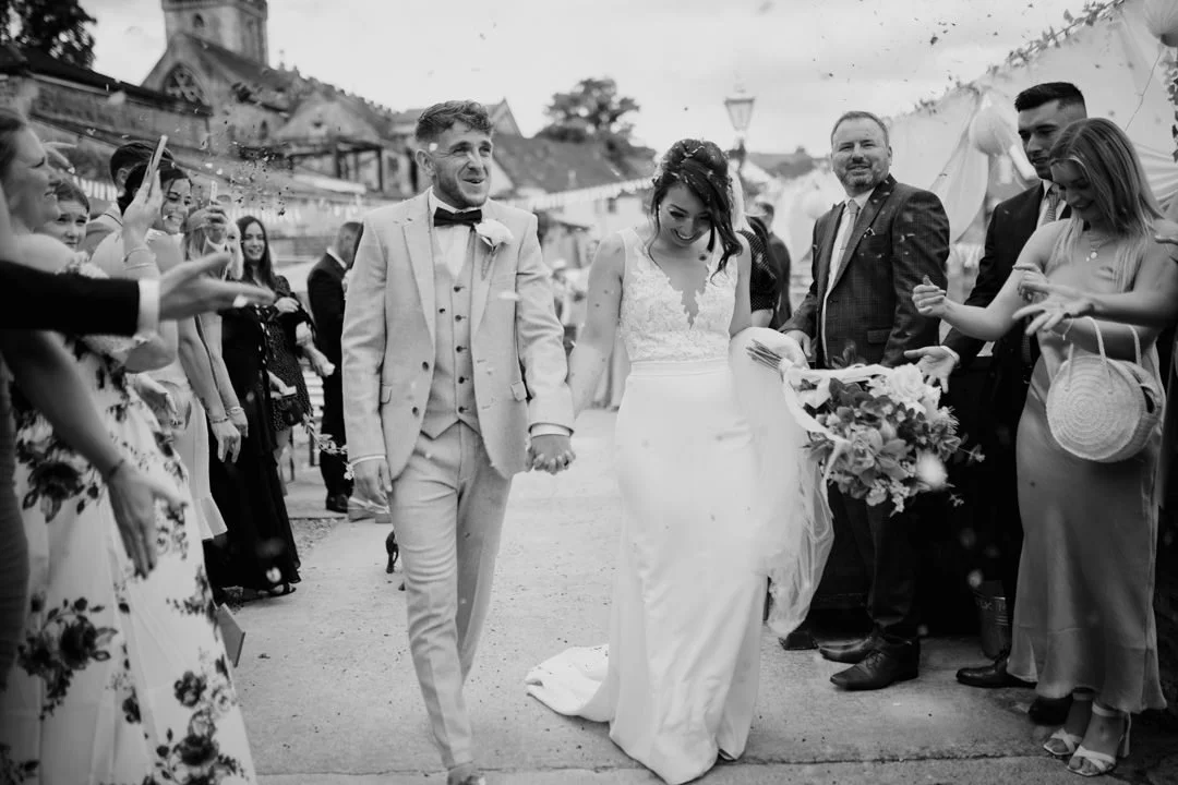 black and white photo of wedding confetti throw