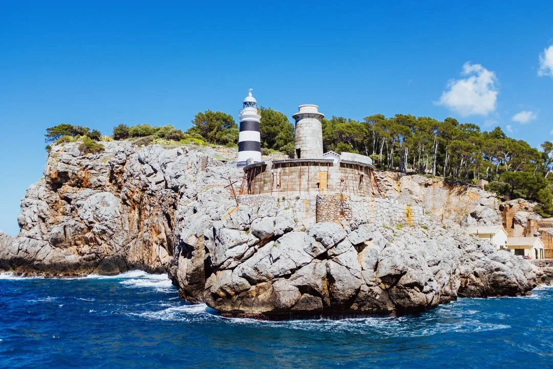 port de sollar lighthouse with blue ocean and blue sky