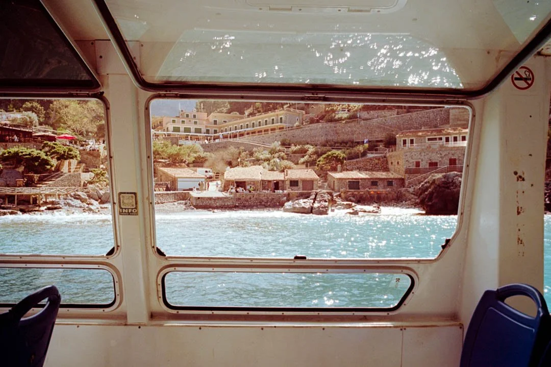 blue ocean with buildings in cliffs, Sa Calobra