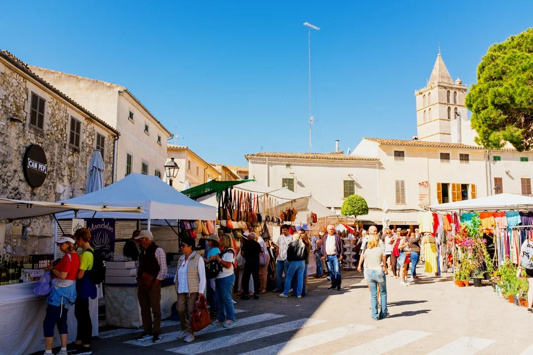 people walking near shops Alcudia Market majorca