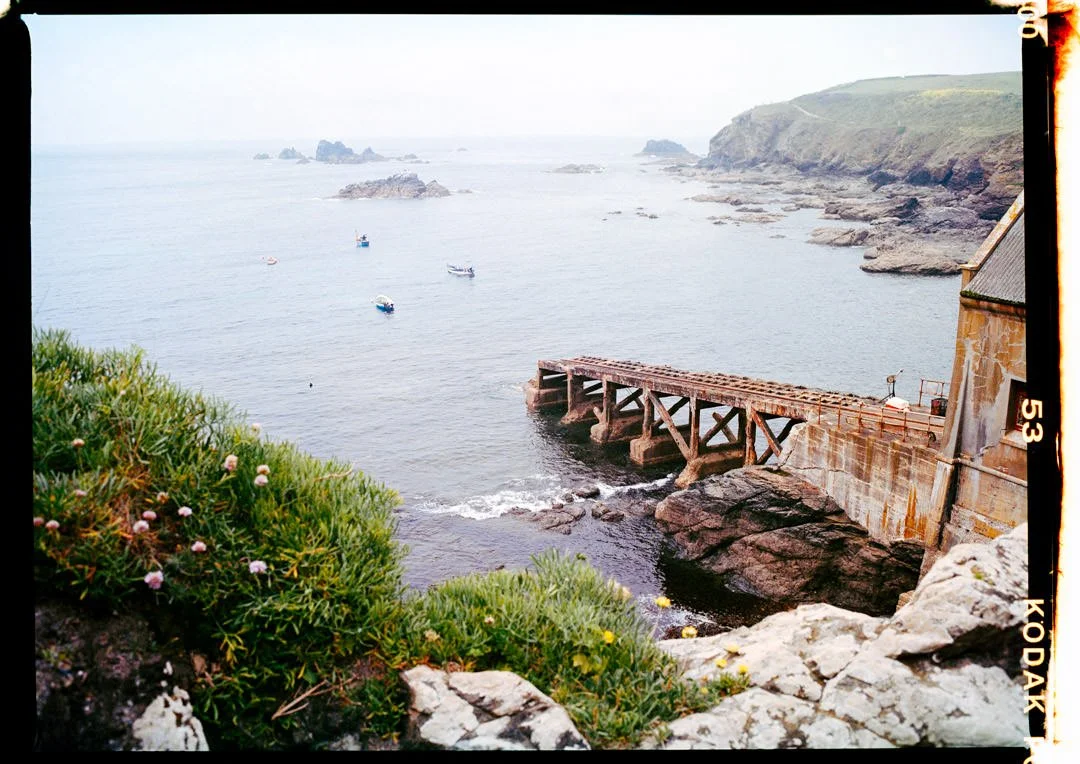 old lifeboat station with blue crashing waves Cornwall. Kodak Portra 400