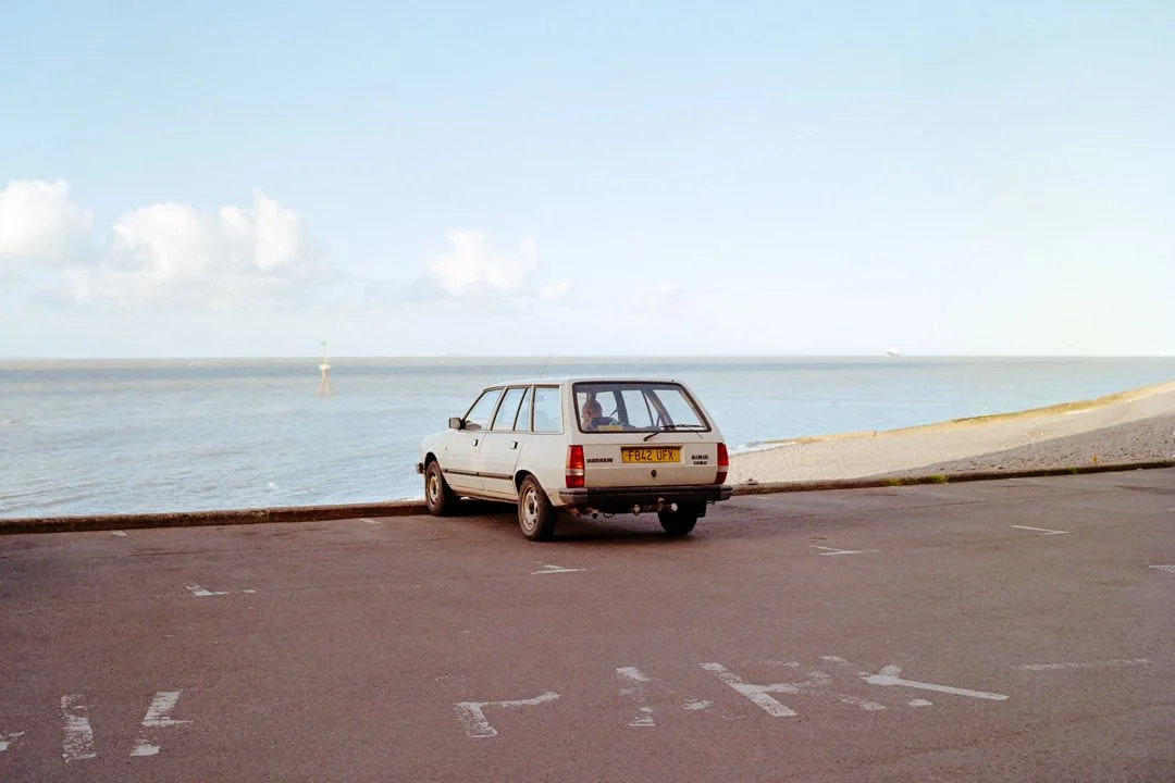 old French Renault car parked up with ocean in the back, Mamiya 645
