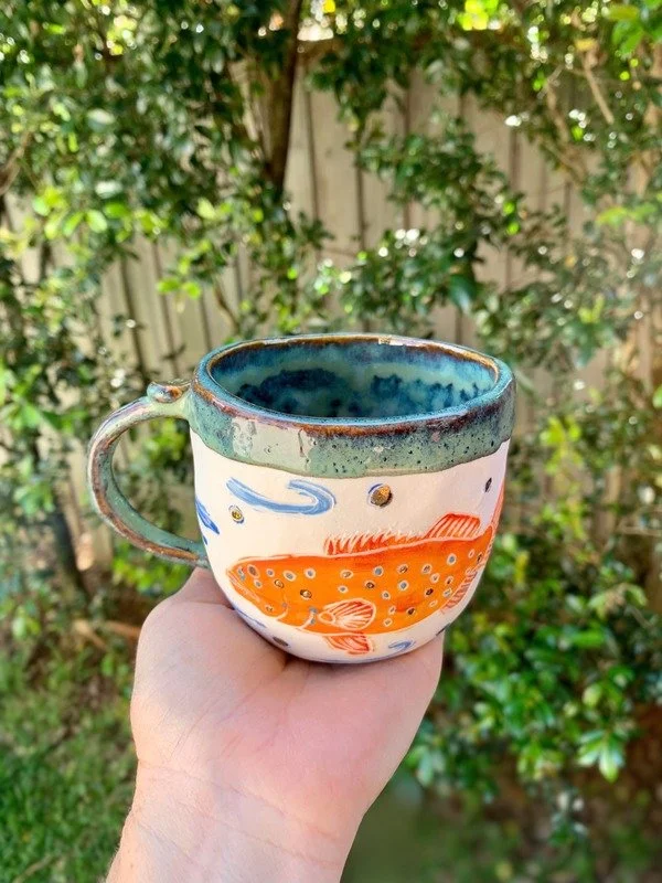 one mug in hand.jpg