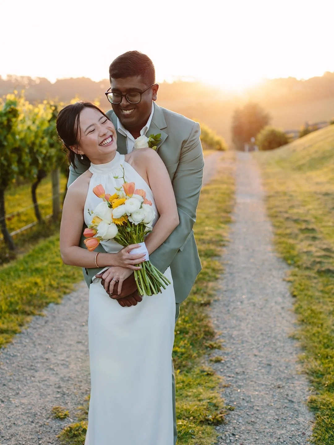Mae and Emmanuel in the beautiful evening glow at @pier10winery ✨
