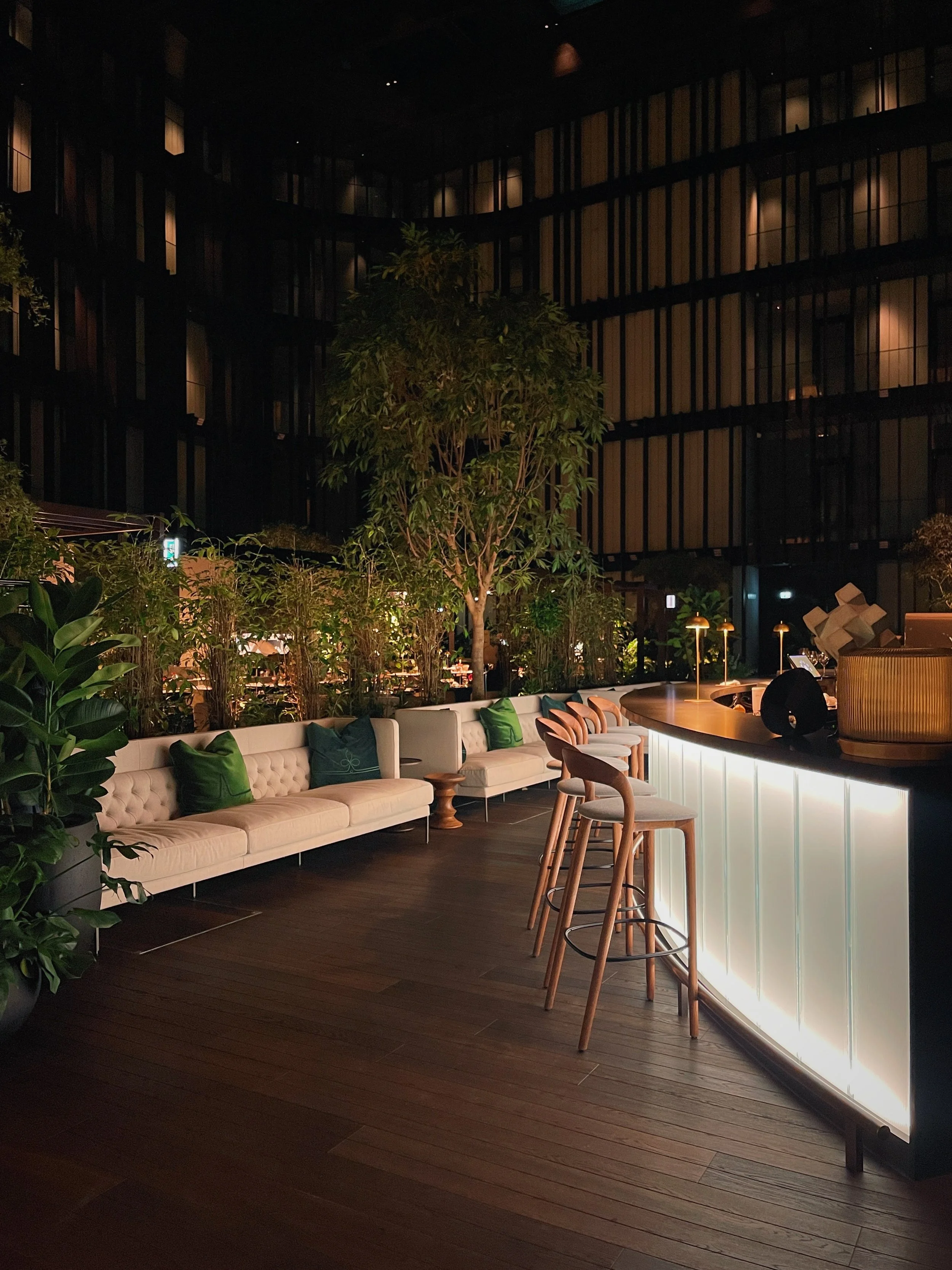 Evening terrace at Dorothea Hotel Budapest with warm ambient lighting and contemporary outdoor seating photographed by Natalia Moreno.