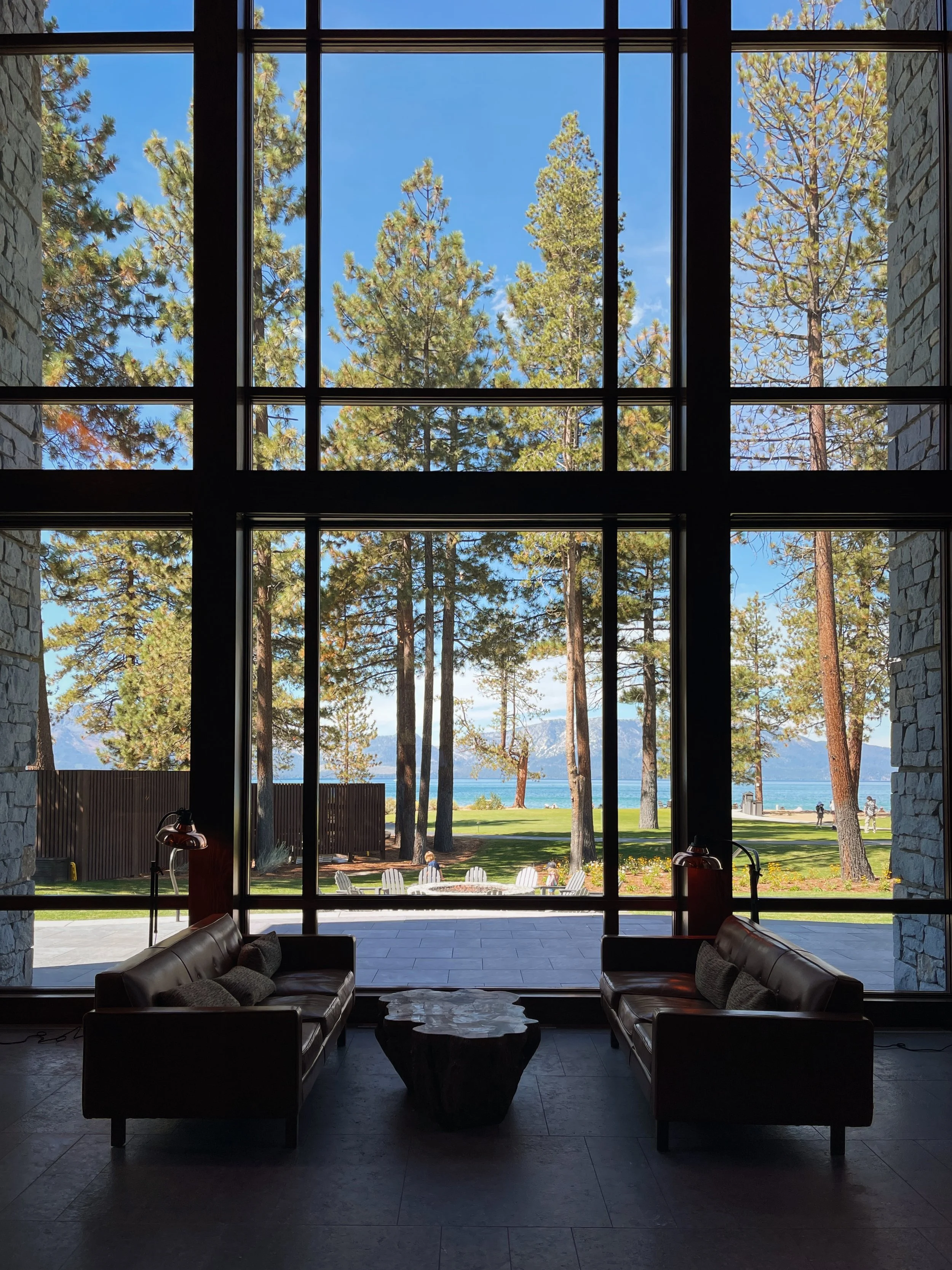 Double-height lounge with lake views at Edgewood Tahoe Resort, Lake Tahoe, United States.