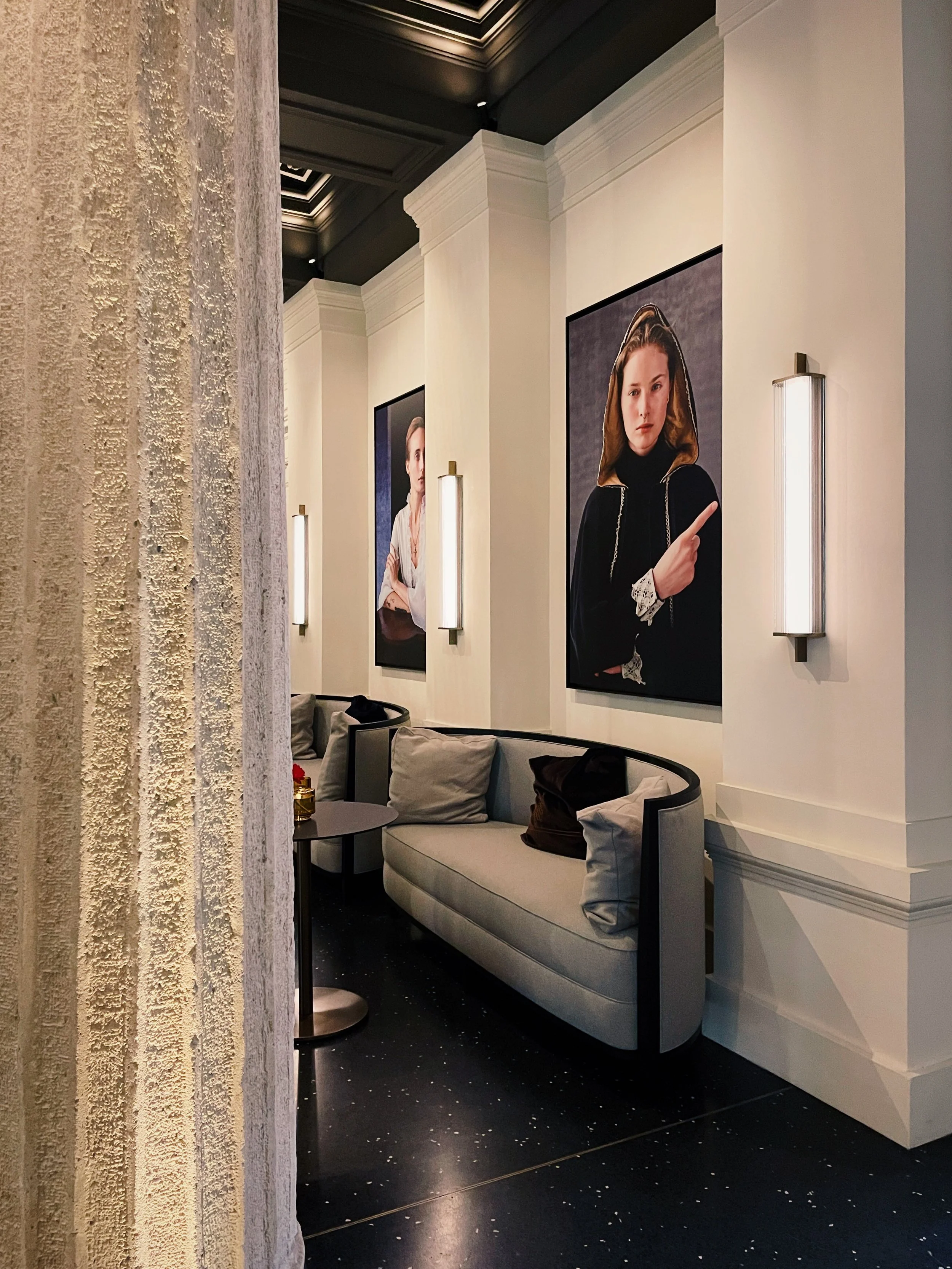Lobby seating area at Dorothea Hotel Budapest with curated artwork and contemporary interior design photographed by Natalia Moreno.