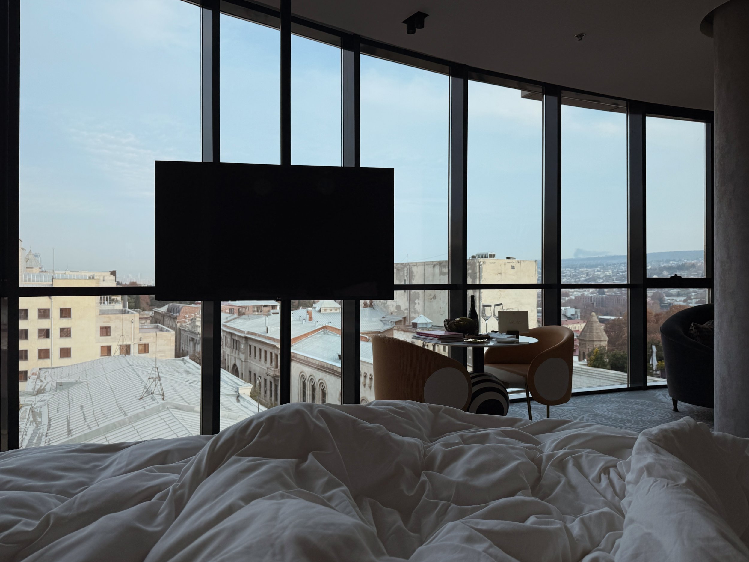 Guest room with panoramic city view at Paragraph Freedom Square, a Luxury Collection Hotel in Tbilisi, Georgia.