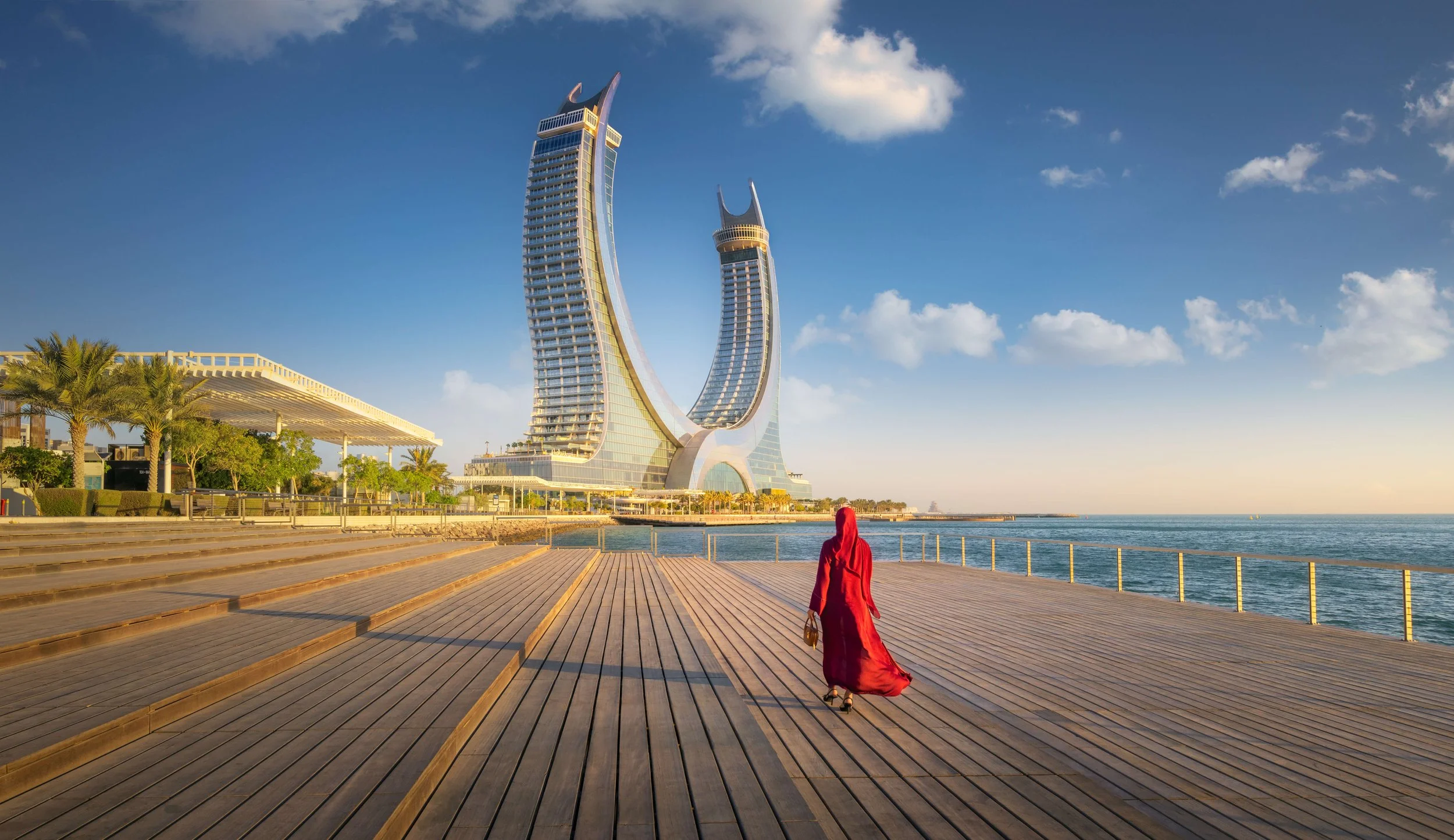 Katara Towers with Qatari lady photo for qatar tourism by Ahmad Alnaji - SARAB